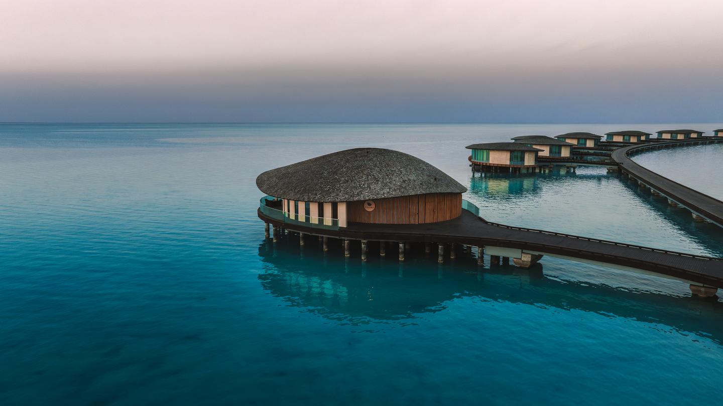 Villa designs ensuring guest privacy and minimal sand infill to preserve the island’s shape