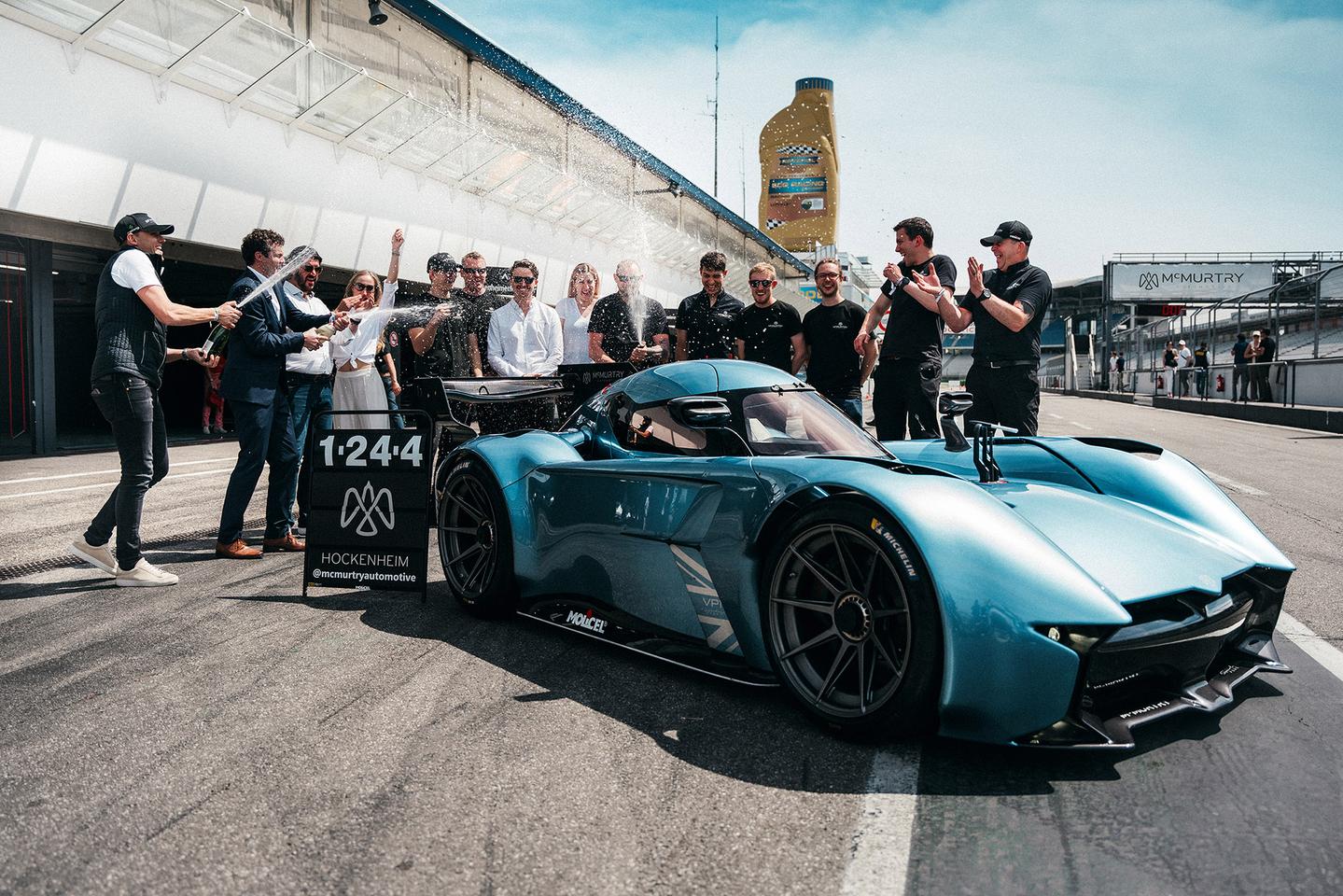 The McMurtry team celebrates with Max Chilton's new lap record at Hockenheim in the Speirling Pure fan car
