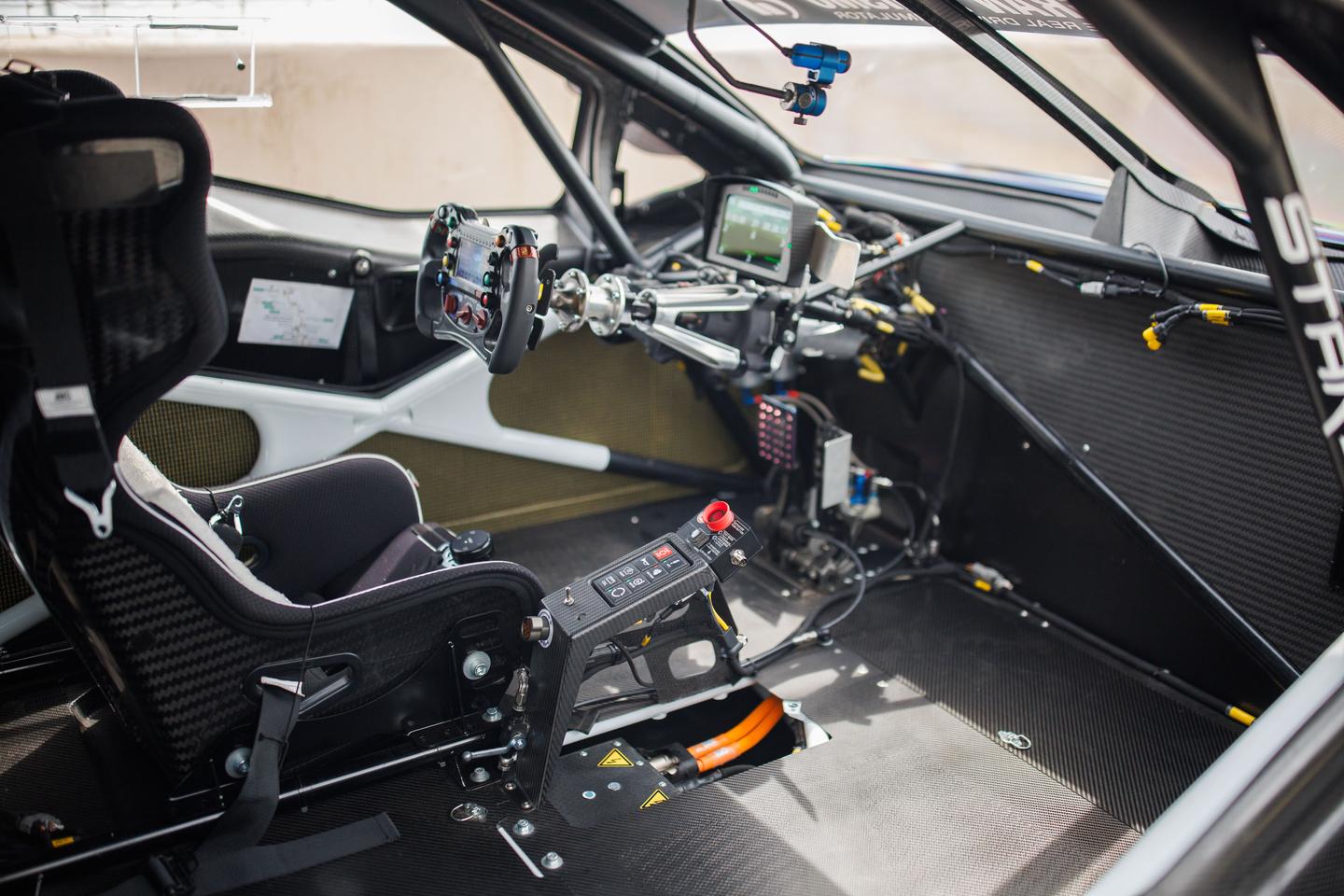 In the spartan cockpit of the F-150 Lightning SuperTruck demonstrator for the 2024 Pikes Peak International Hill Climb will be pro driver Romain Dumas