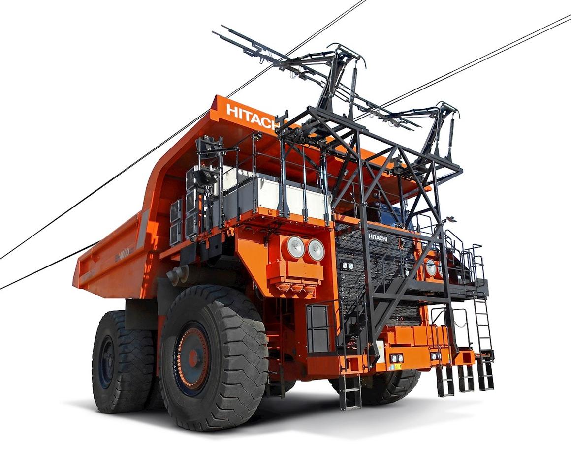 A trolley system installed to the front of the battery electric dump truck prototype allows for continuous operation without needing to stop for recharging