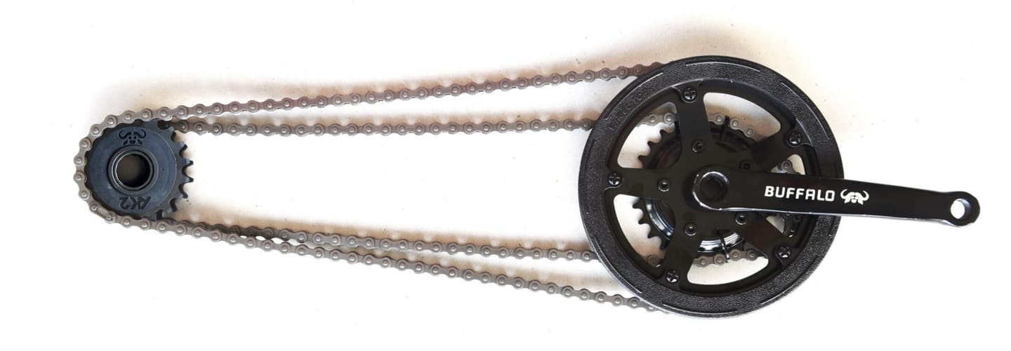 The Buffalo S2 Utility's two-speed drivetrain includes a switchable freewheel with two cogs that are each paired with a corresponding chainring via their own single-speed chain