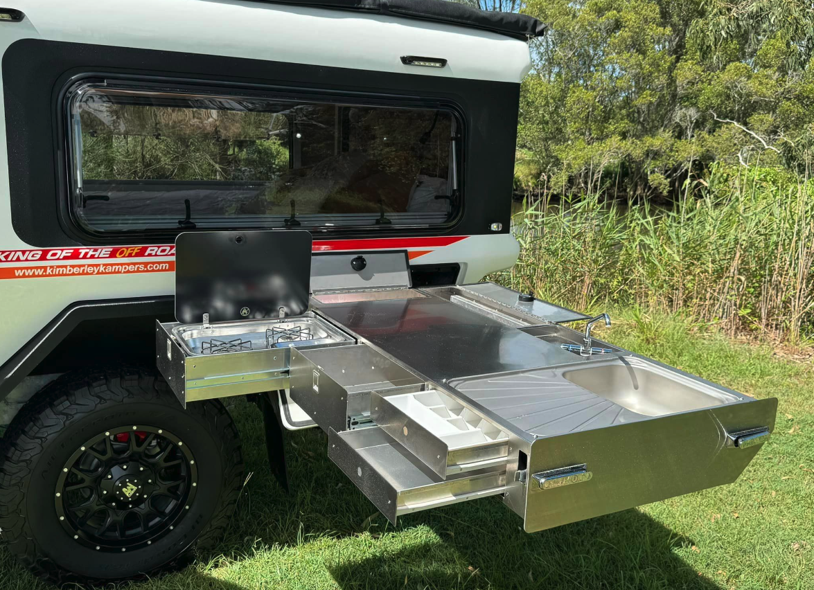 Kimberley gives the Kube a larger interior without taking up floor-to-ceiling space with a tailgate galley, providing plenty of awning-protected cooking space on its slide-out