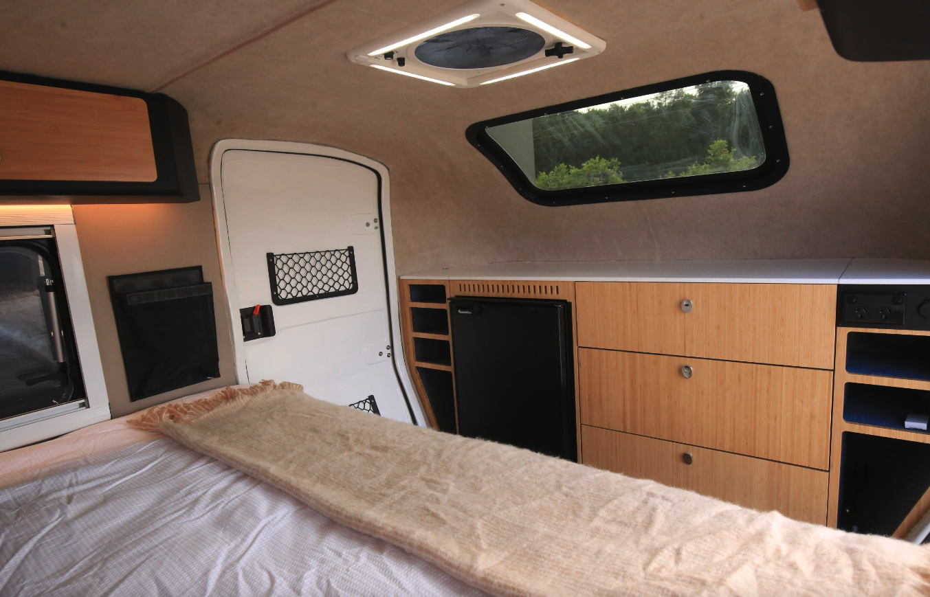 The front console features loads of storage, a shelf for placing drinks and other things, and an 85-L fridge