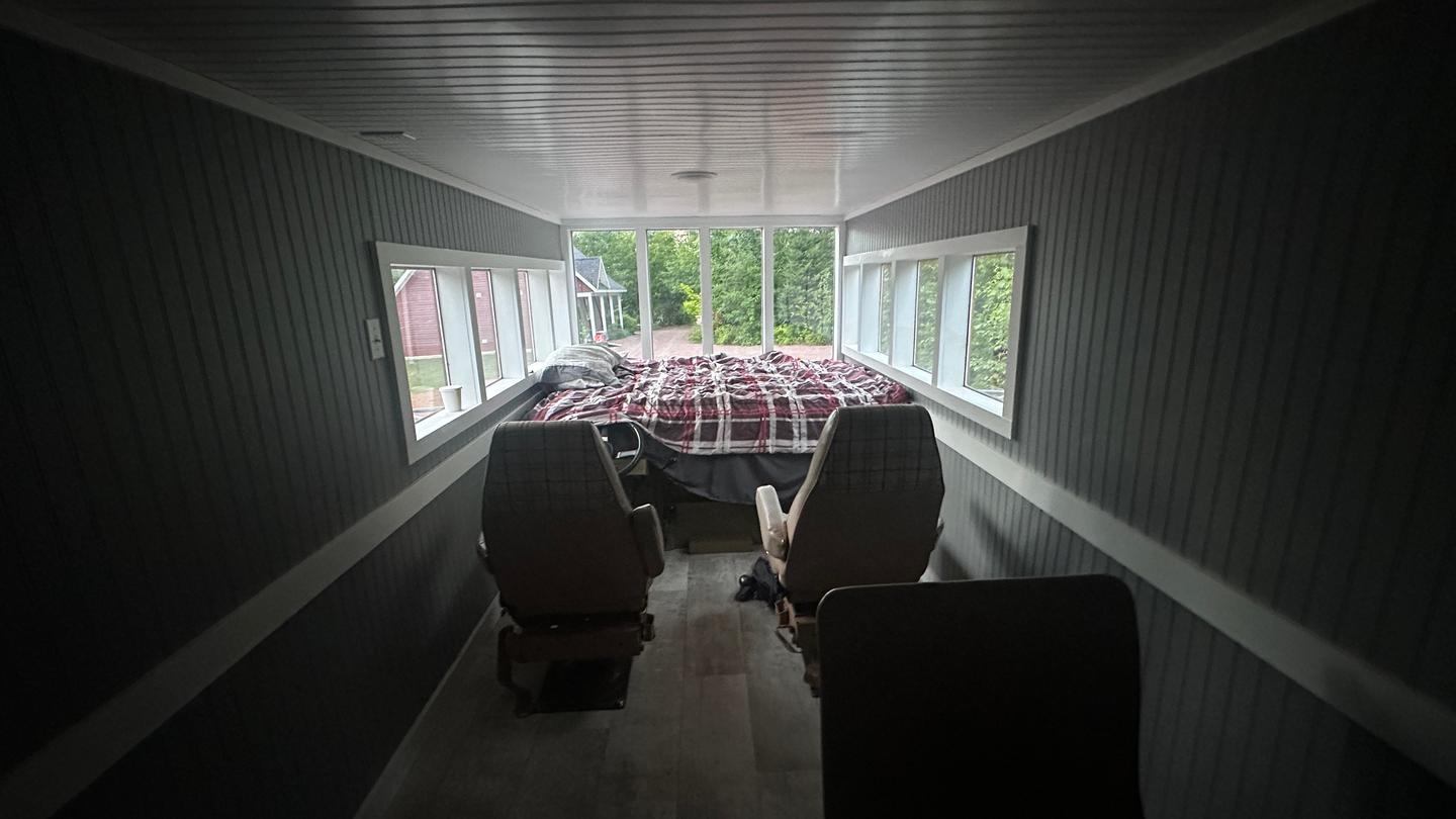 The Rubishack's passengers sit in seating sourced from an old 1970s campervan