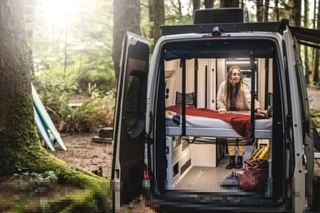 The power-lift bed adjusts between day and night modes, allowing campers to bring along oversized gear and cargo