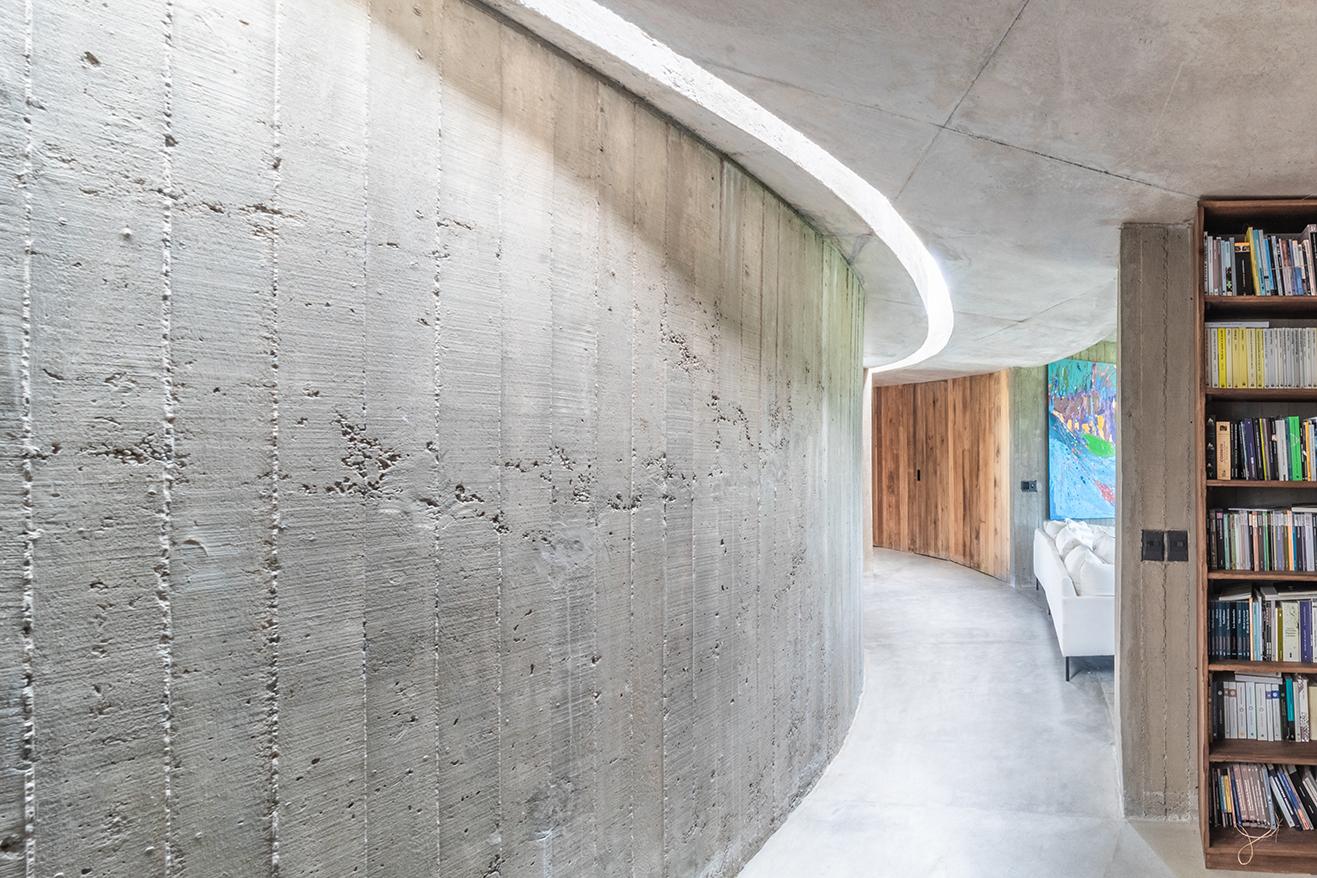 The Shire's interior decor is made up of exposed concrete and wood