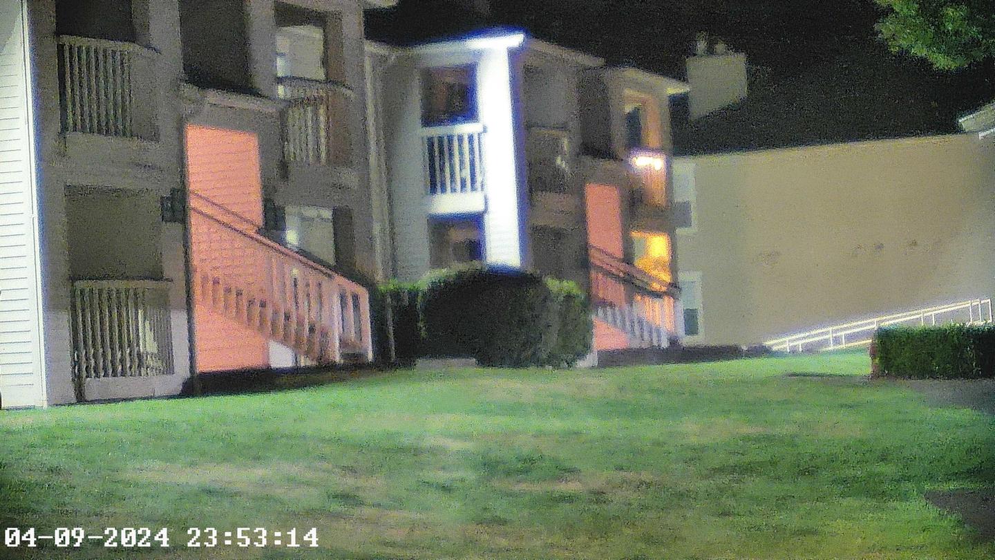 Full color image of a darkened front lawn