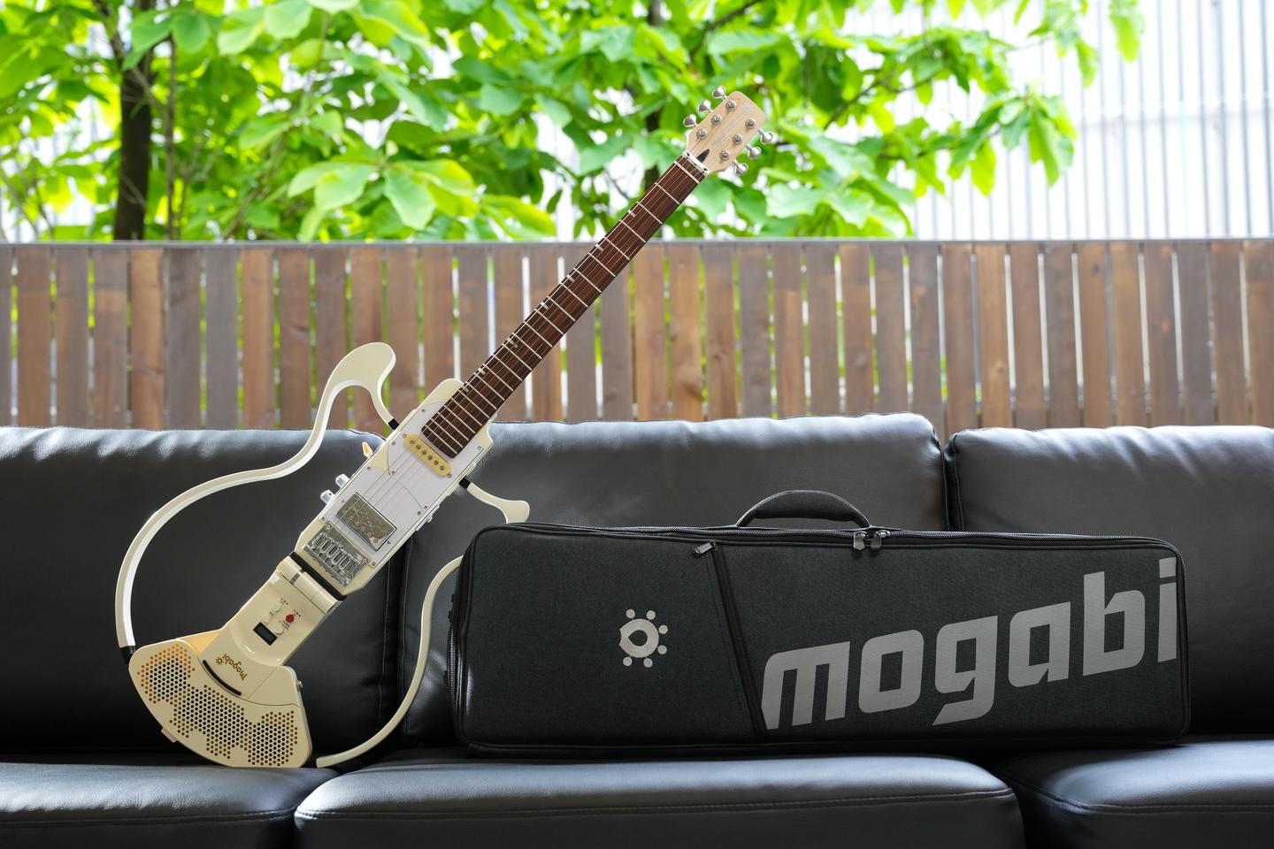 The Mogabi V3 electric travel guitar ships with a fabric case