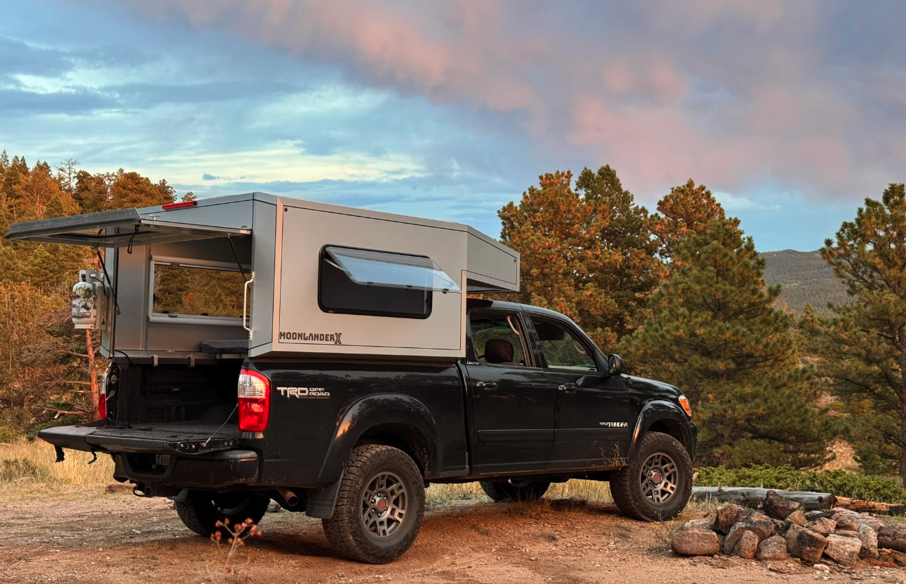 The Moonlander X clamps to the top of the pickup bed rails and opens with a lift-gate