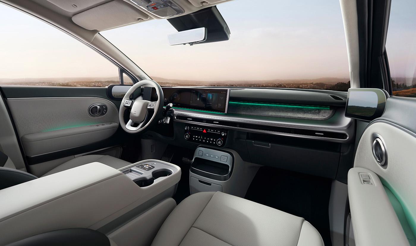 The cabin is packed with thoughtful creature comforts, driving assistance features, screens, and charging ports