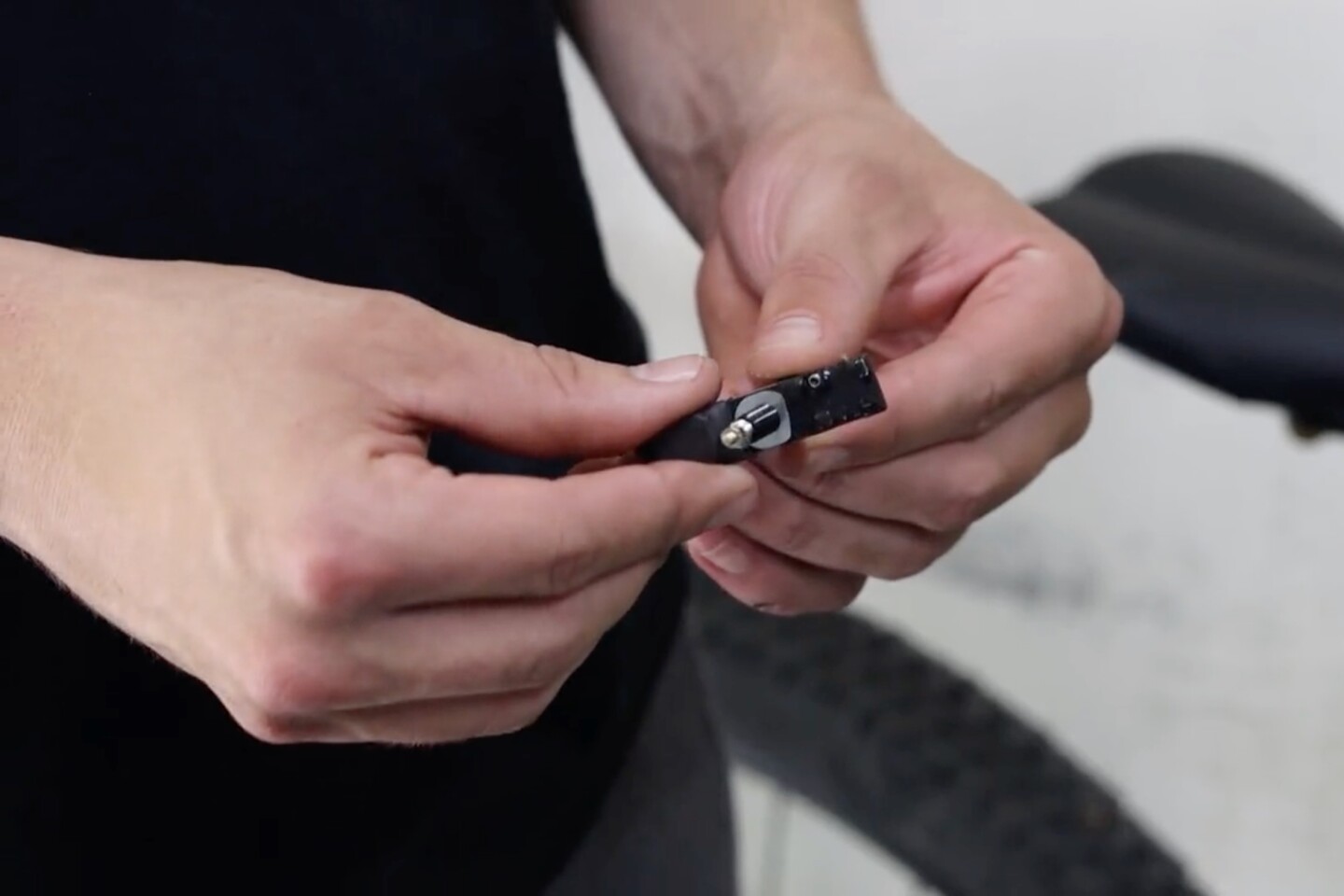 The wheel's existing valve stem is inserted through the Outrider