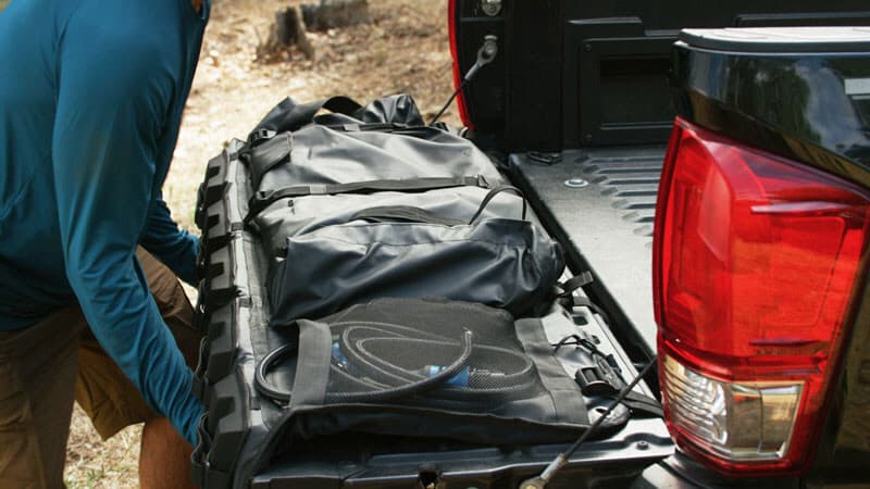 The RinseKit Tailgate Shower measures 52.5 inches wide by 6.5 in thick by 20 in high (1,334 by 165 by 508 mm)