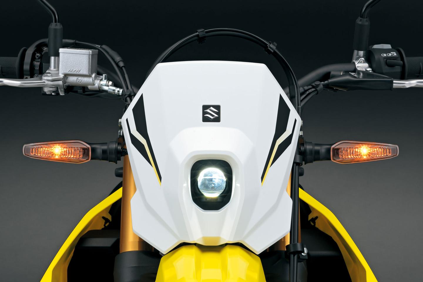 The rectangular halogen headlight of the old DR-Z400S has been finally replaced with a sleek bifunctional LED headlamp