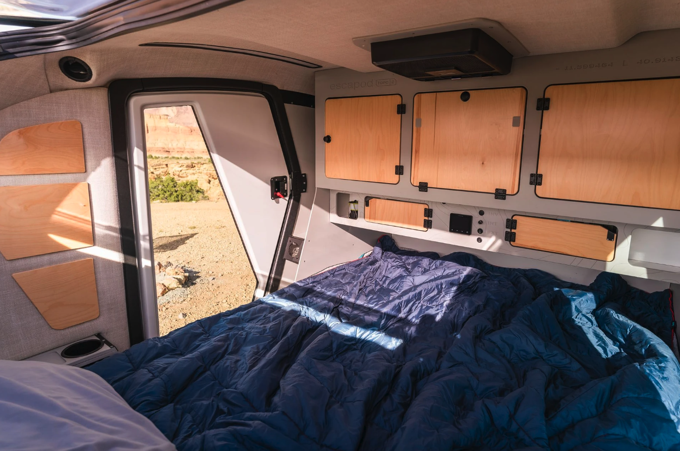 Escapod has trimmed out the interior in soft-touch materials and wood to ensure it's just as warm as the original Topo (which featured Baltic birch in its construction)
