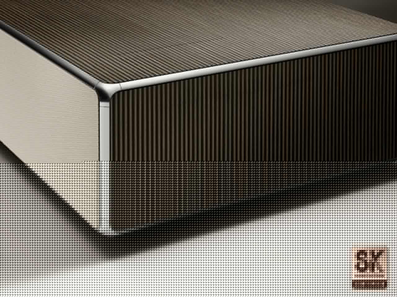 A light fabric speaker grille hides a 100-W Atmos sound system, plus clever technology that tweaks the output so it appears to be coming from the screen