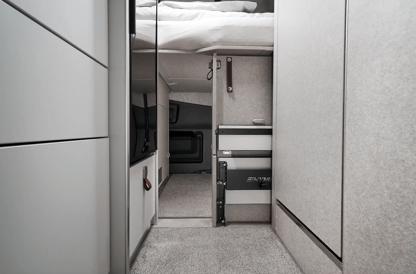 Under-bed pass-through door to garage