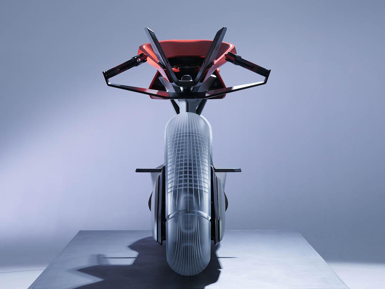 The motorcycle's engine is concealed in the attached bridge between the two wheels