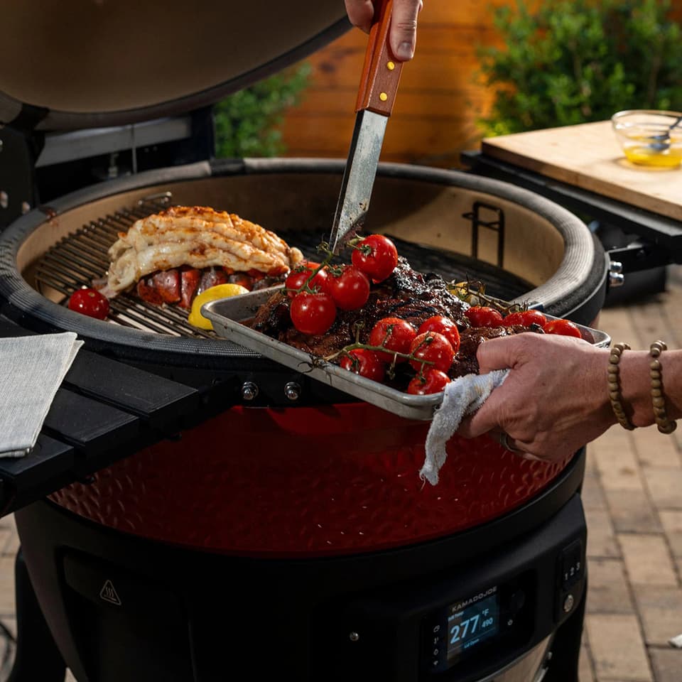 The Big Joe Konnected Joe offers 450 square inches of cooking surface, along with a two-tier cooking setup and folding shelves on either side of the grill
