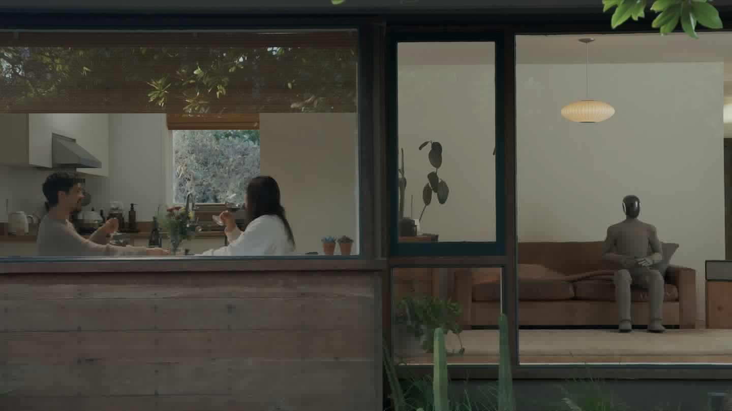In a Wes Anderson-like shot, Neo Gamma sits alone