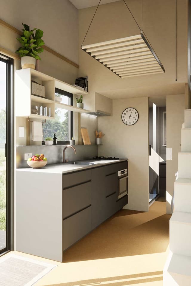 The Funhouse's kitchen includes an oven, two-burner propane-powered stove, and a fridge/freezer