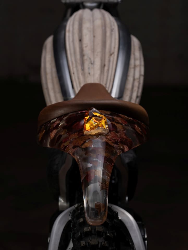 The traditional LED headlight and taillight have been switched out for hand-blown glass sculptures