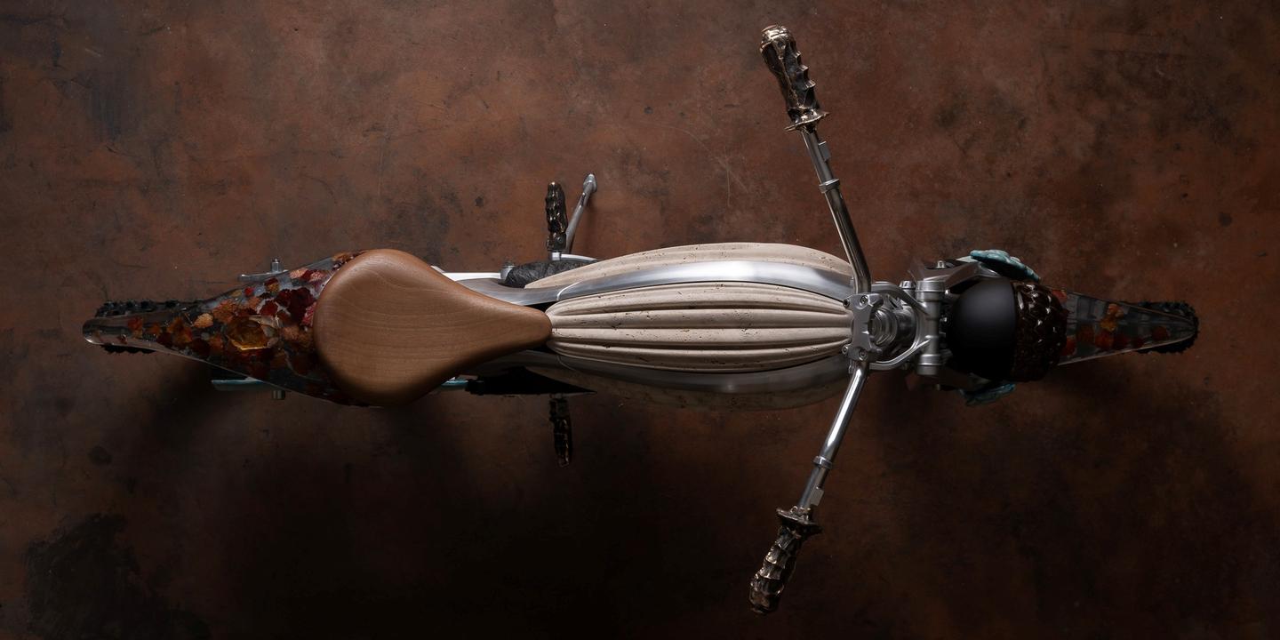 The tank is made of travertine, a stone typically found around mineral springs, masterfully shaped to replicate the flowing contours of a parachute