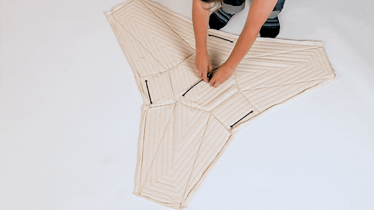 A tension cord helps give this inventive side table its shape