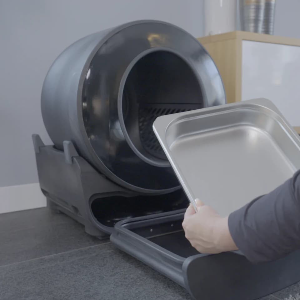 You can empty out the litter box's waste with a stainless steel tray or cardboard ones available from the company, and skip plastic bags