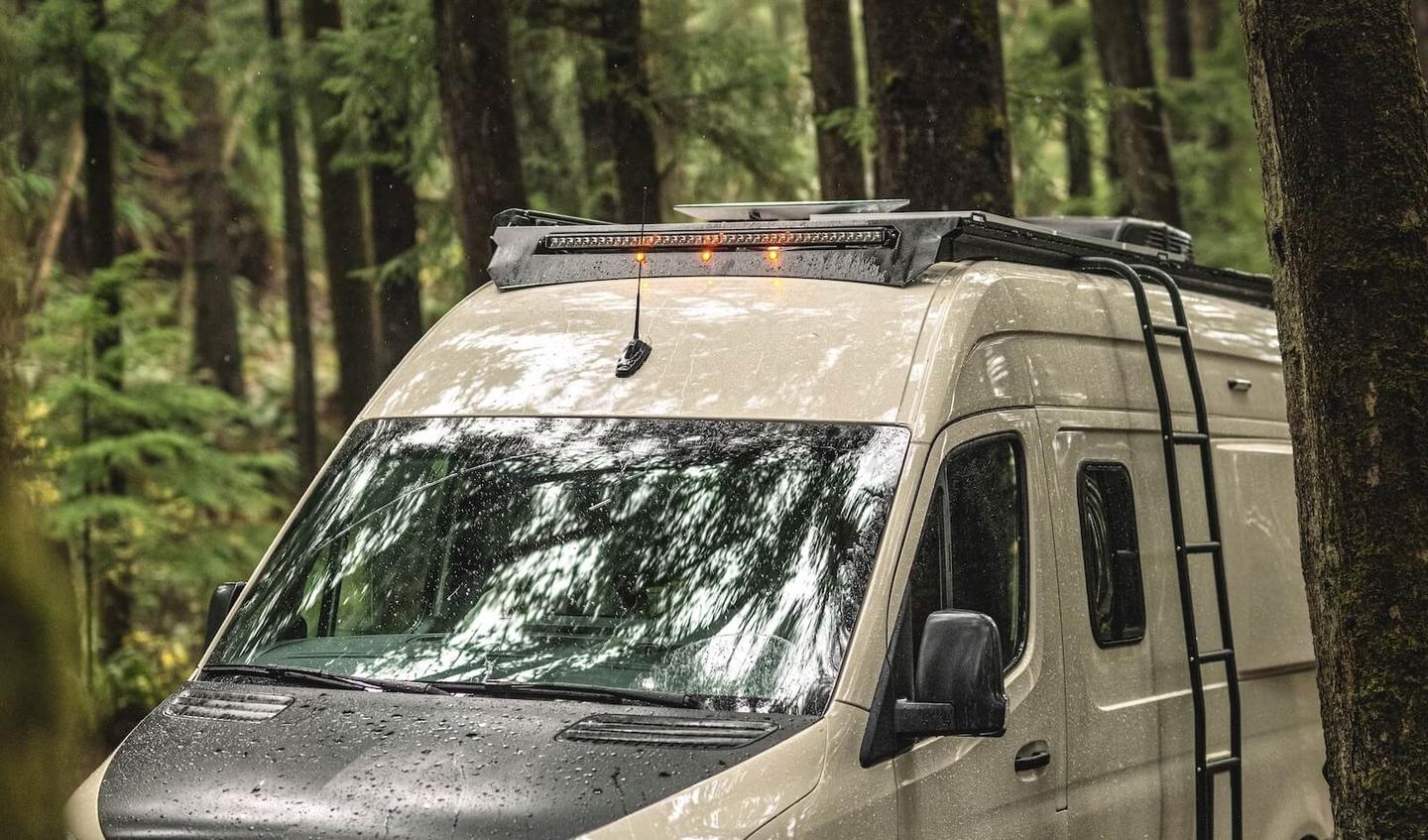 Like the GH1 pictured, the GH2 features a roof rack, ladder and available Starlink Mini dish; the van also comes as standard with Starlink prewiring so buyers can add the dish later