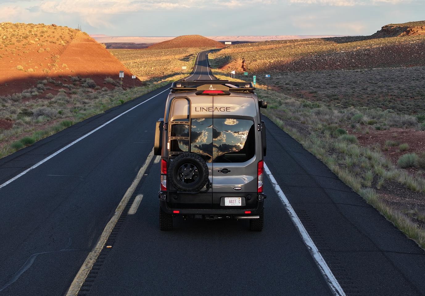 Grand Design moves the spare tire to a carrier on the back of the van, making room for the underbody split-system condensor/compressor air conditioning, which feeds into a vent over top the bed