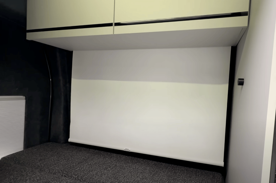 The retractable projector screen delivers in-bed entertainment