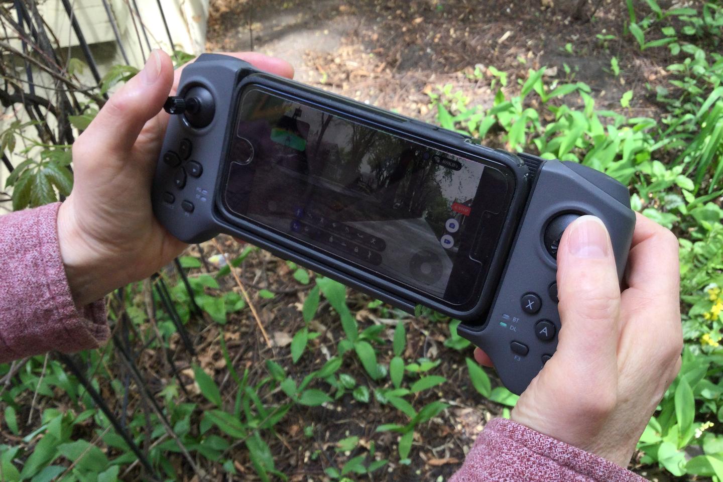 The joystick remote features an adjustable-width bracket for your smartphone