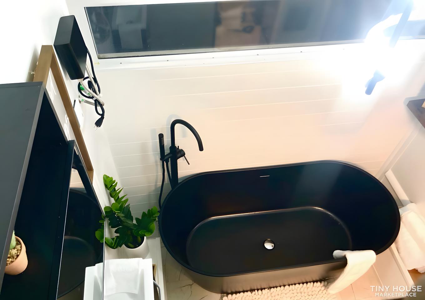 The Nano Micro House's bathroom features a soaking tub and shower