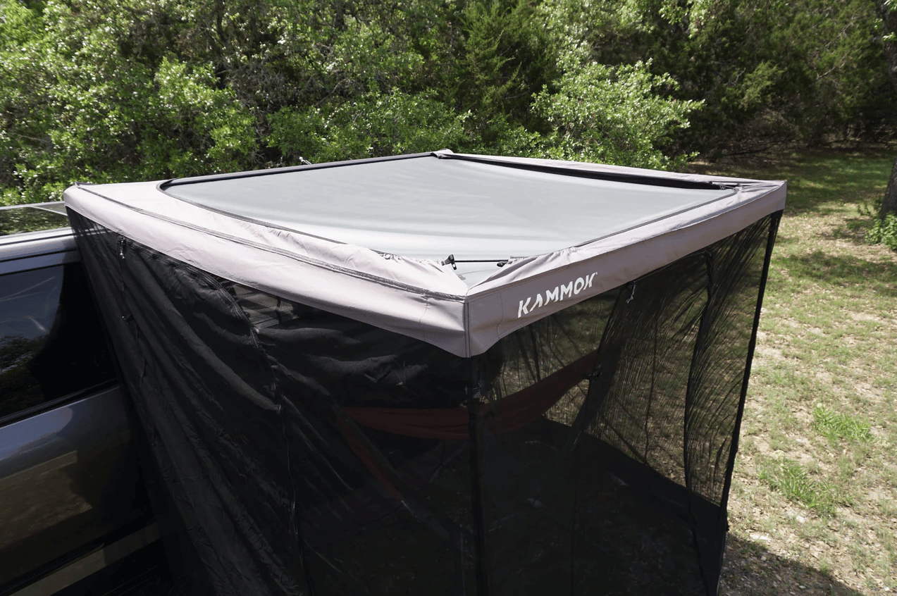 Kammok says Bug Room setup involves a one-time height adjustment to the vehicle, then a simple elastic stretch around the outside of the Crosswing awning; stakes and poles are included for windier weather