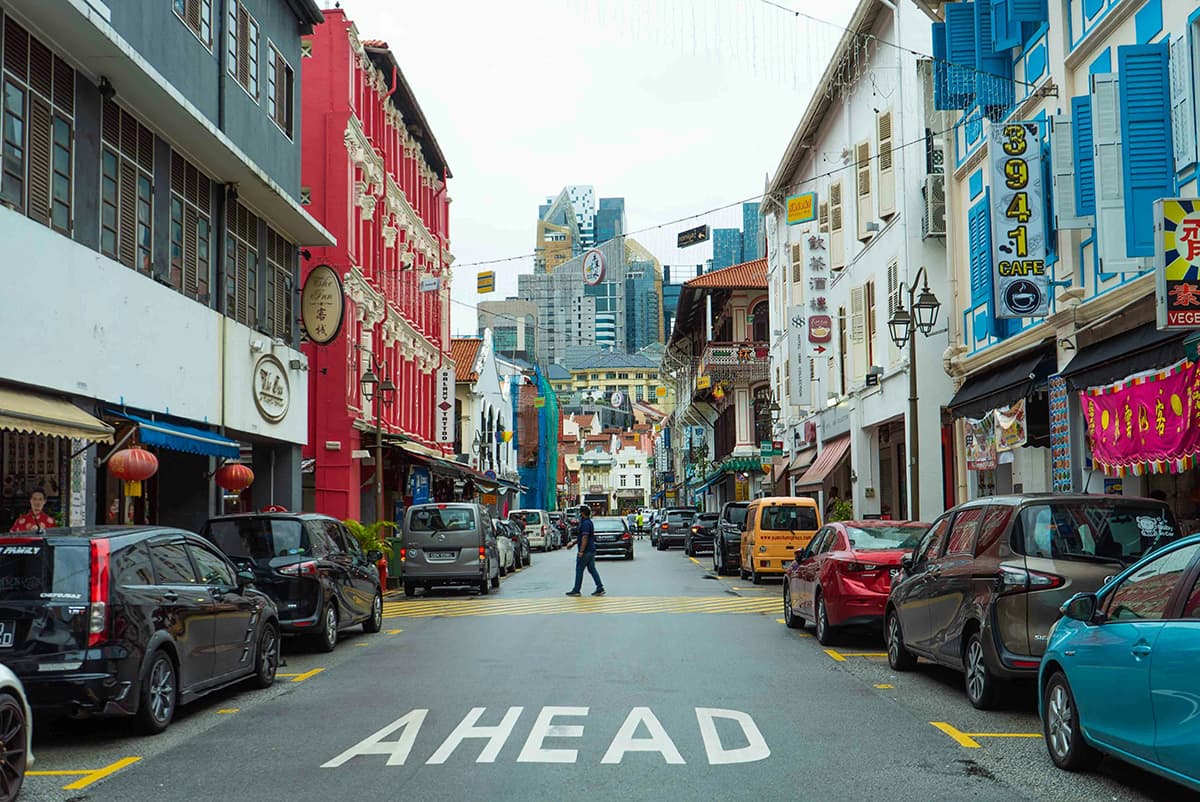 Singapore is not only densely populated, but also has a humid climate in which water vapor prevents heat from escaping into the atmosphere